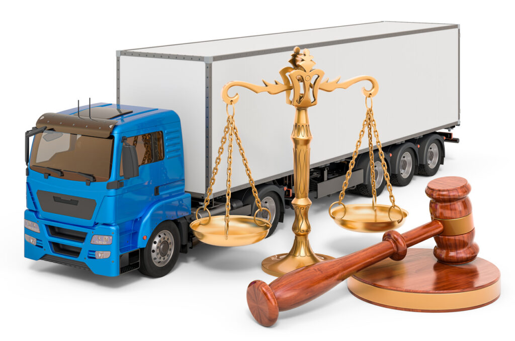 Truck with wooden gavel and scales of justice.